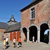 Tourists visiting the castle farm at Falaen in the Ardennes, Belgium